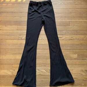 Black ribbed flare pants with a stretchy waistband size 4
